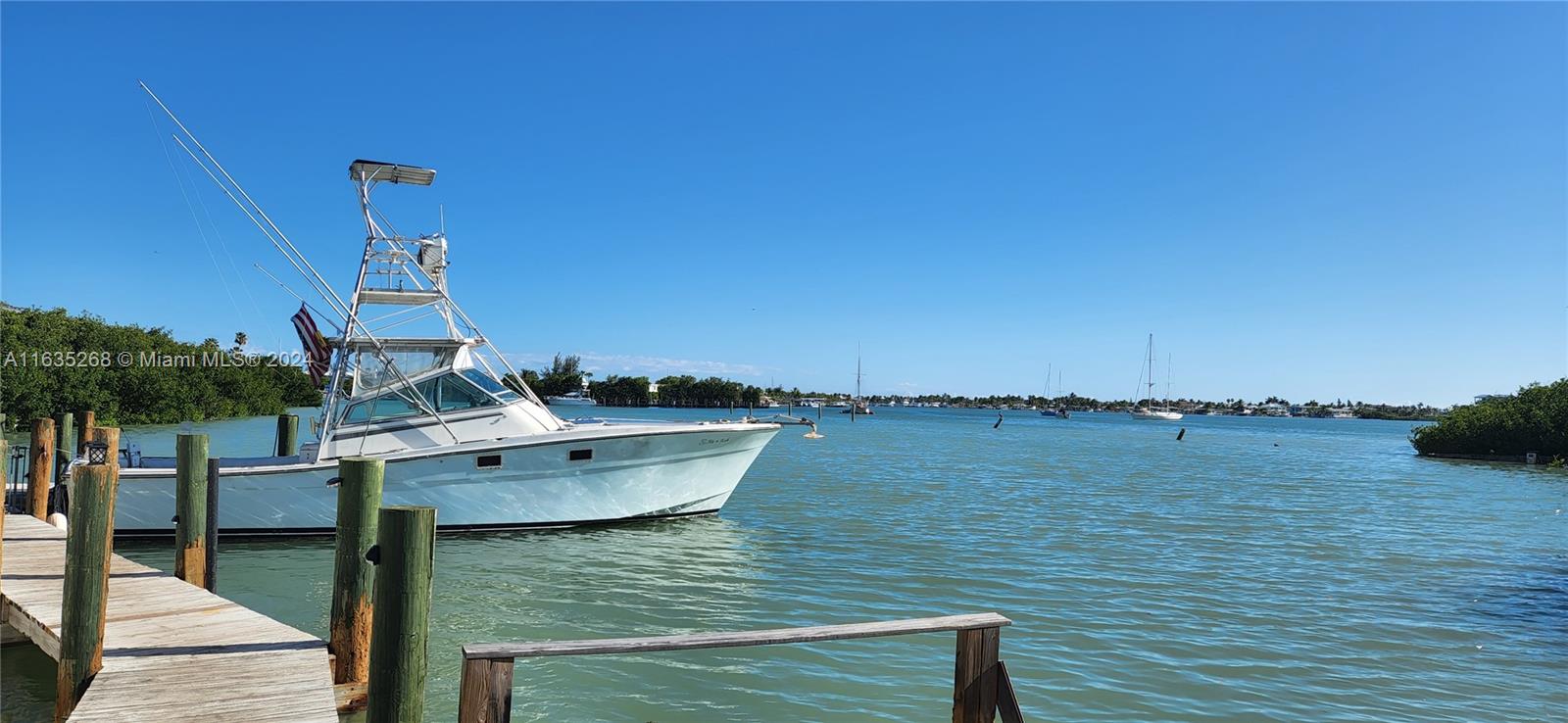 Best deal for waterfront acreage in Keys minutes to airport-private/charter. MU Zoning allows wide range of opportunities for new owner: single family(1-4 home compound) or add TDR's, marina, large hotel, boat dealership or more just bring your TDR's. 3 acres M.O.L. fronting US-1 & additional 3 acres of bay bottom. Included in offering: 3 resi, 1 transient & 1 com TDRs, water & sewer lines to each of the 2 upland lots installed & paid for; Marina license, open dock permit to allow immediate alteration, likely bay bottom dredge. Unique feature is strip of land +650 ft along the bay bottom may serve as access to boat slips. current dock can fit a large sportfisher & more. Seller via Don Craig & Company consultants 3211sf of commercial allowed. Also listed as RLD A11593395