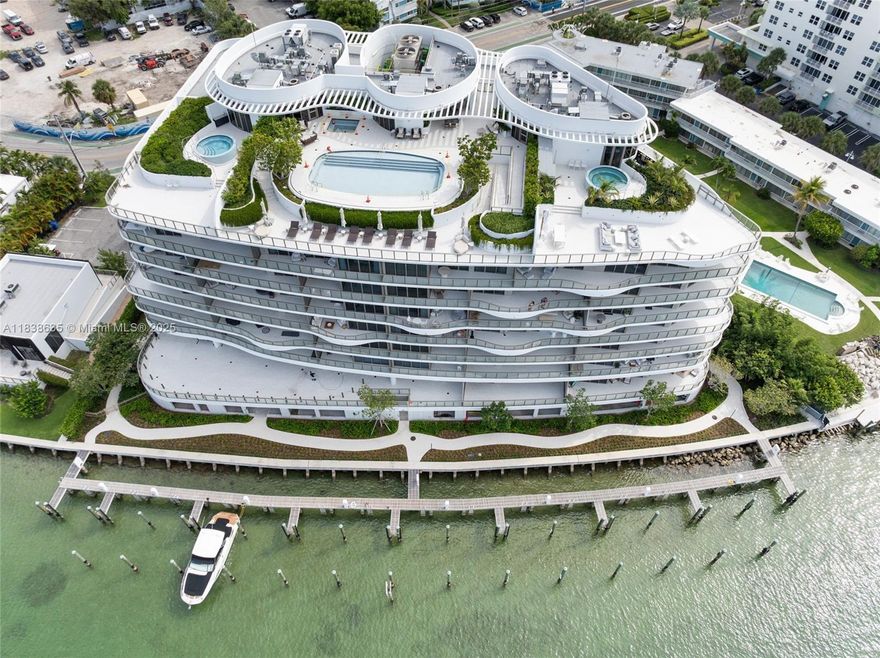 Experience the pinnacle of waterfront luxury in Onda Residences in the heart of Bay Harbor Islands. The unit seamlessly blends indoor elegance w/ outdoor serenity. This 2 bed/3 bath retreat features 2,109 sf of total living space, a private elevator, your very own private marina & boat slip, den, Statuarietto marble along with Snaidero cabinetry, italian porcelian flooring, floor to ceiling windows, Miele appliances, Dornbracht faucets & world class amenities.  Every detail is crafted for comfort and exclusivity. Developed by the award-winning team Valerio Morabito & Ugo Colombo and designed by Arquitectonica.  Inspired by the waves of the sea combined w/ sleek modern lines. Bal Harbor Shops, fine dining and top-rated schools are within minutes from the home.