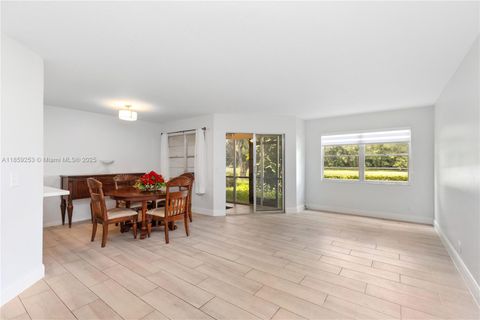 Photo of 1110 SW 125th Ave #112M, Pembroke Pines, FL 33027 (MLS # A11859253)