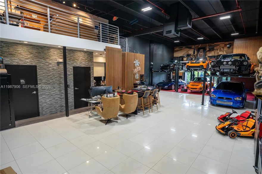 Experience a rare opportunity to own an exceptional private auto and art storage facility designed for discerning collectors, investors, and enthusiasts who value security, sophistication, and flexibility. This luxury flex space offers a premium environment ideal for housing exotic, classic, and specialty vehicles, as well as fine art, memorabilia, wine, and other high-value collectibles. Thoughtfully designed with both function and presentation in mind, the property delivers a refined industrial aesthetic with the versatility to serve as a private showroom, storage suite, creative workspace, or exclusive retreat. High ceilings, expansive open space, and upscale finishes create an impressive setting that elevates far beyond traditional warehouse or storage options. Whether used for showcasing a curated car collection, protecting valuable artwork, or creating a customized luxury lounge environment, this space offers endless potential for personalization. Located for convenience and built for privacy, the facility caters to owners seeking a secure, low-traffic setting with a prestige feel and a true collector-focused atmosphere. This is more than storage—it is a statement property that blends passion, lifestyle, and practicality into one unique ownership opportunity. Ideal for those who appreciate automotive culture, design, and exclusivity, this luxury flex space stands apart as a premier destination for storage, display, and personal enjoyment.