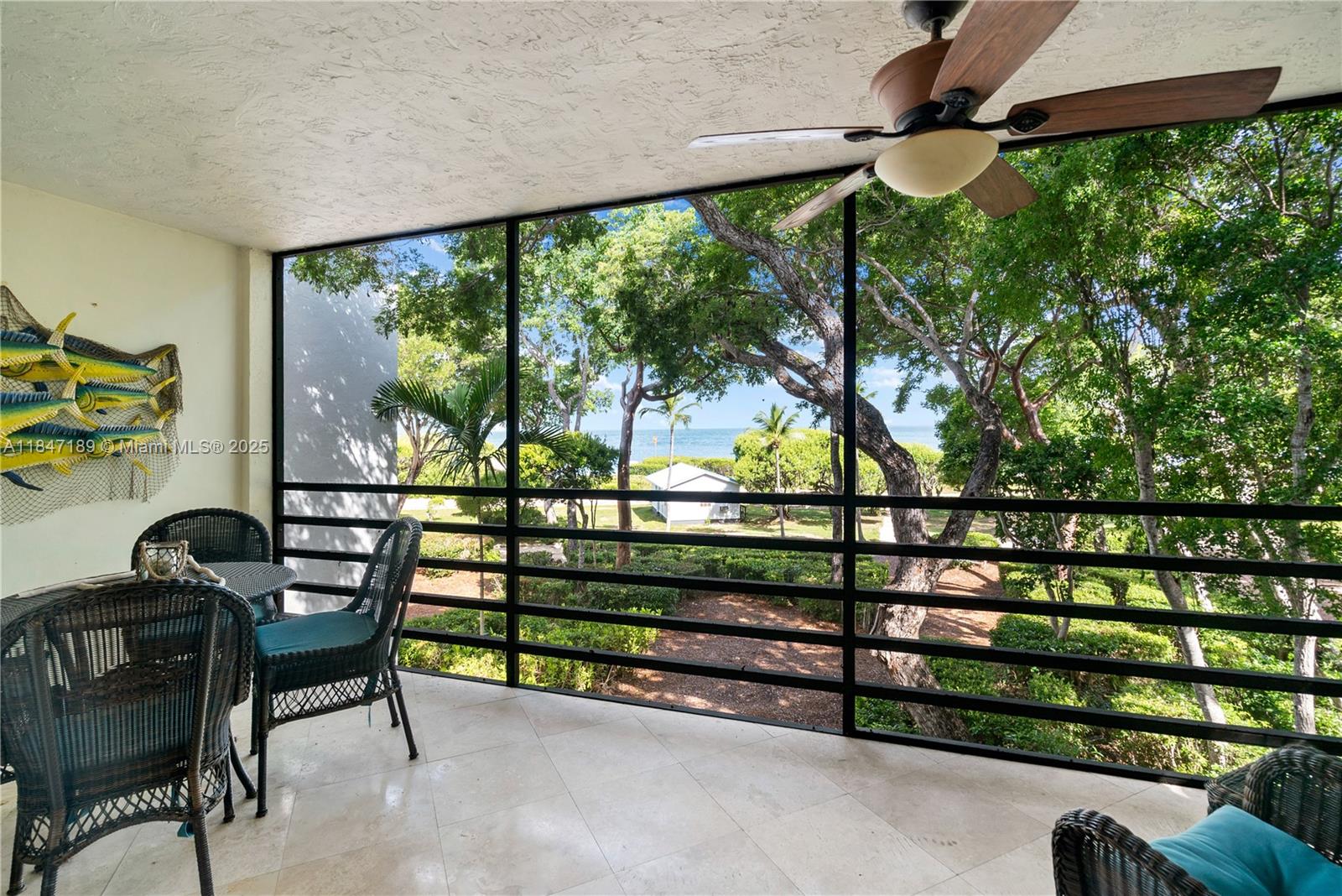 Nestled within the private enclave of The Sanctuary Key Largo, this townhome offers an exclusive retreat on twenty-four acres of verdant hardwood hammock. Overlooking the serene Florida Bay, residents can indulge in the splendor of sunset vistas from double-decker screened-in porches. This 3-bedroom, 2.5-bath sanctuary boasts a spacious, open kitchen, complemented by a large living area. It is also one of the only 3-bedroom units in the complex. The community's amenities enhance its allure, featuring a historic clubhouse, pool, tennis court, gym, sunset tiki, and boating facilities, including in-and-out boat service and on-site dockage. Embrace the Key Largo lifestyle with nearby access to premier dining, shopping, and aquatic adventures.