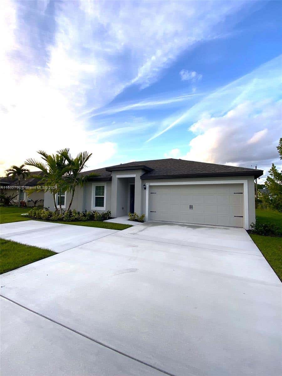 Photo of 331 SW Thornhill Dr, Port Saint Lucie, FL 34984 (MLS # A11602796)