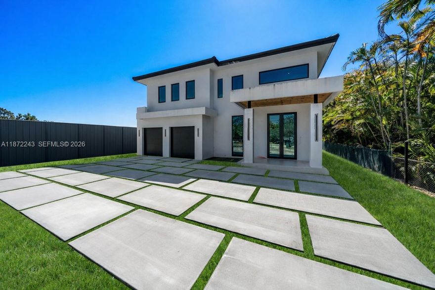 Be the first to own this brand-new 5-bed, 5-bath modern masterpiece set on a 20,468 sq ft lot, with expected completion in March 2026. Thoughtfully designed with exceptional finishes, the home features elegant porcelain tile floors, a sleek tube elevator, hurricane-resistant construction, and an EV-ready 2-car garage. The gourmet chef’s kitchen showcases Thermador appliances, quartz countertops, and custom cabinetry, creating a refined space for everyday living and entertaining. Upstairs, a versatile loft complements a serene primary suite with a private balcony, dual walk-in closets, and a spa-inspired bath. The deep backyard retreat offers a pool, summer kitchen, and expansive space to relax or host guests in style.