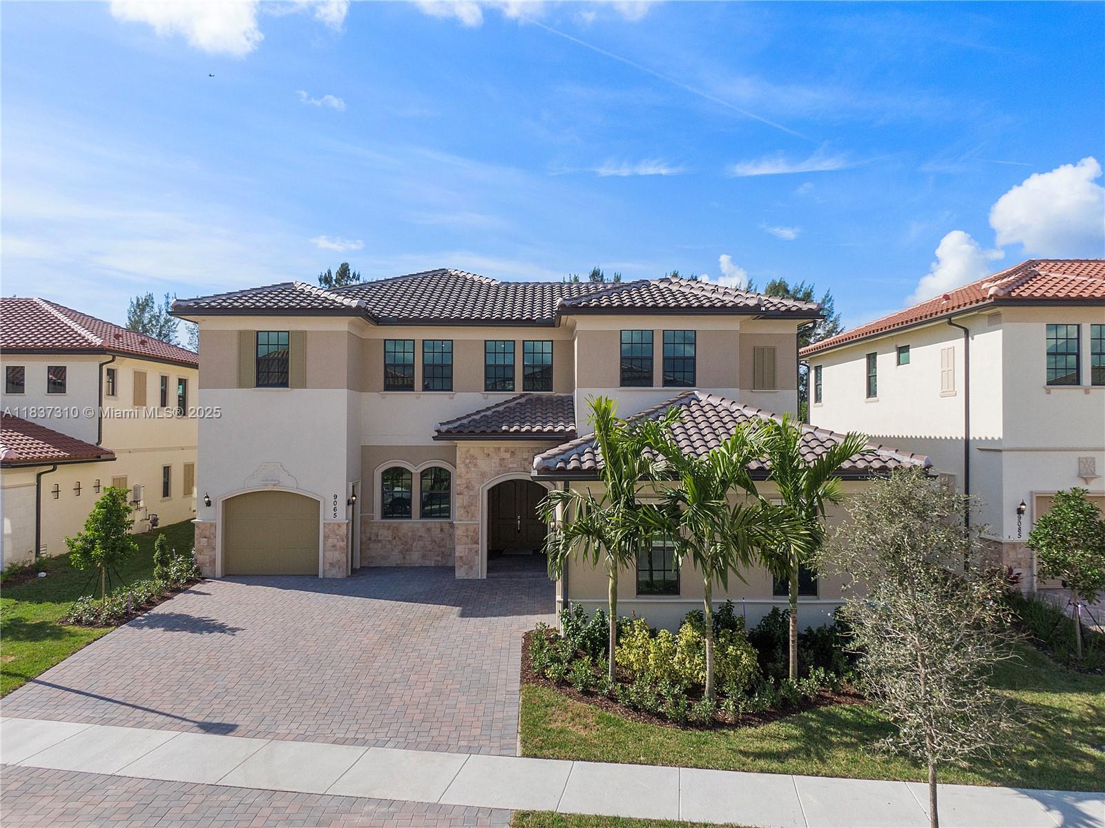 Stunning 5BR/4.5BA lakefront home in the prestigious gated community of Parkland Bay. This spacious residence features an open-concept layout with a chef’s kitchen, quartz countertops, gas range, and stainless steel appliances. Enjoy soaring ceilings, abundant natural light, and serene water views from the expansive great room. The upstairs primary suite offers a private balcony, sitting area, spa-style bath, and dual walk-in closets. A downstairs guest suite, large loft, and covered lanai with outdoor kitchen complete the home. Community amenities include a resort-style clubhouse, fitness center, pool, tennis courts, and lakeside trails. A must-see for luxury South Florida living.