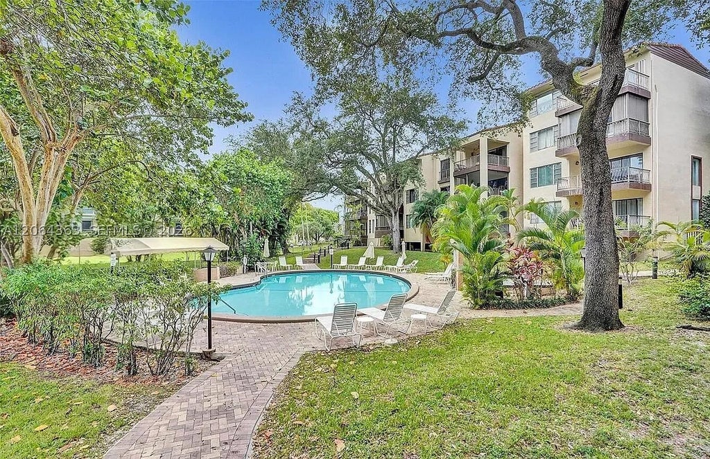 Photo of 6060 S Falls Cir Dr #313, Lauderhill, FL 33319 (MLS # A12064363)