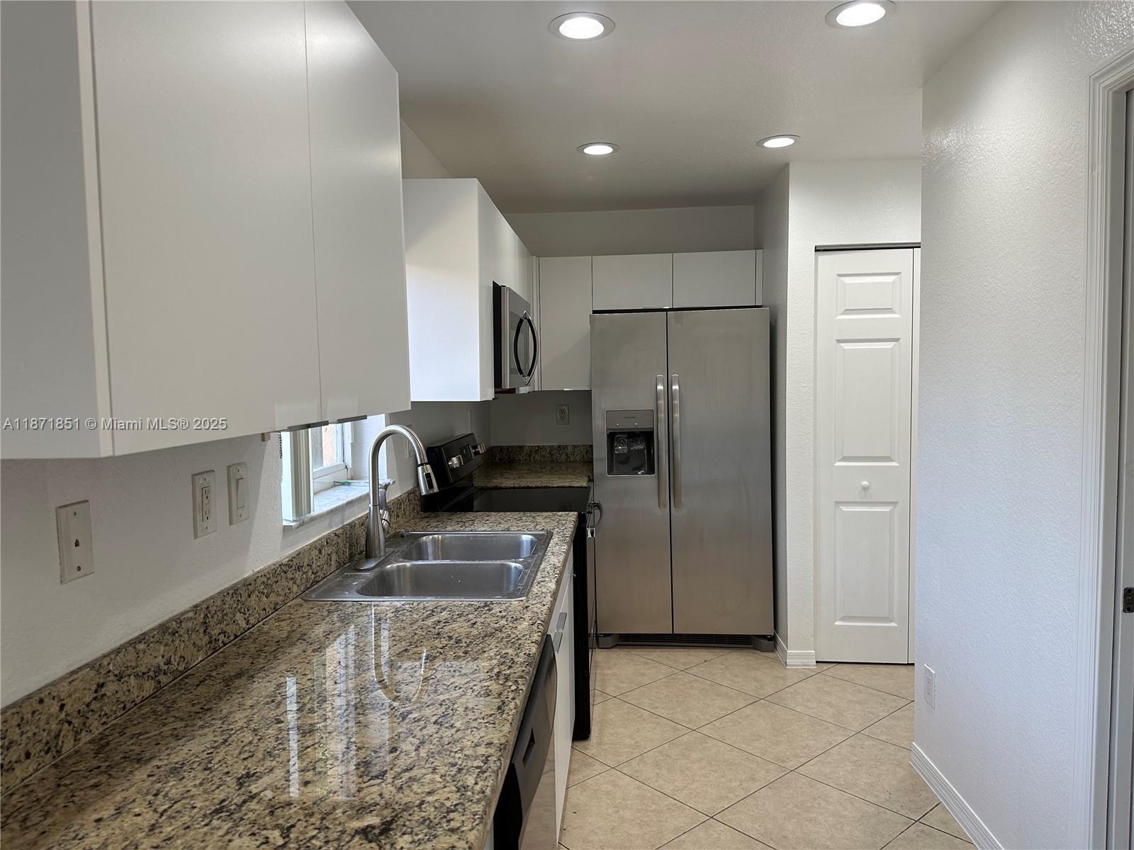 Charming townhome in the heart of Hallandale Beach! This stunning 2-story gem is nestled in a quiet and secure gated community, offering the ultimate in comfort and convenience. With 3 spacious bedrooms and 2.5 baths, it is ideal for anyone to call home. Take a refreshing dip in the on-site pool, perfect for relaxation and creating cherished memories. Enjoy the ease of having a washer and dryer right in your unit and the luxury of a private parking garage. The allure doesn't end there—a large, newly redone backyard beckons you to unwind and entertain in style. The upgraded kitchen boasts new stainless steel appliances, elegant cabinets and granite countertops, making it a chef's delight. Don't miss the opportunity to experience this perfect blend of modern living and a prime location.