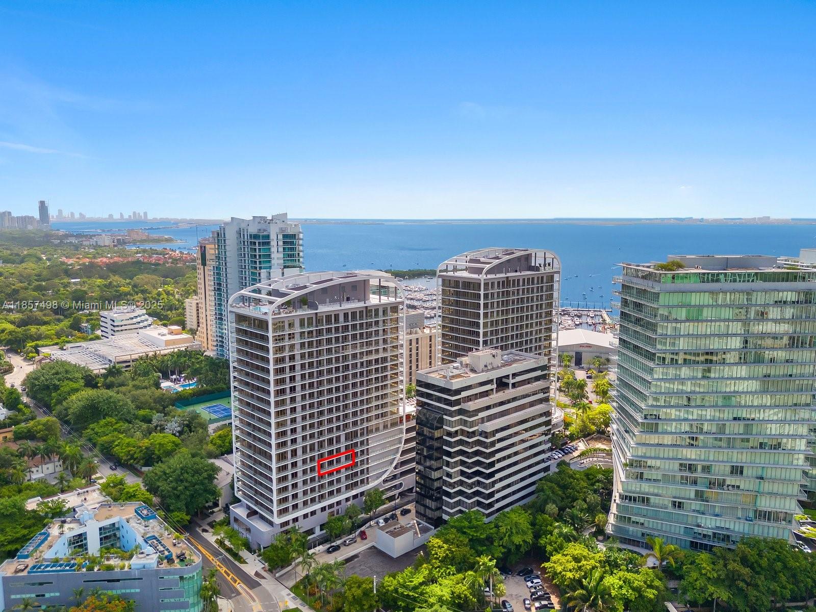 Stylish 2-bed, 2.5-bath condo with marina, skyline, and Grove views. Offering 1,300 sq ft plus a 194 sq ft balcony, this home features 10-ft ceilings, floor-to-ceiling windows, motorized shades, and a custom Italkraft kitchen with SubZero appliances and water filtration. The primary suite boasts custom closets and a spa-inspired bath. Amenities include a rooftop pool and sundeck, second pool deck with bar and lounge, fitness center, resident lounge, conference room, private offices, 24-hr valet/security, and a gourmet market. Steps to CocoWalk dining, shopping, parks, and all Coconut Grove has to offer.