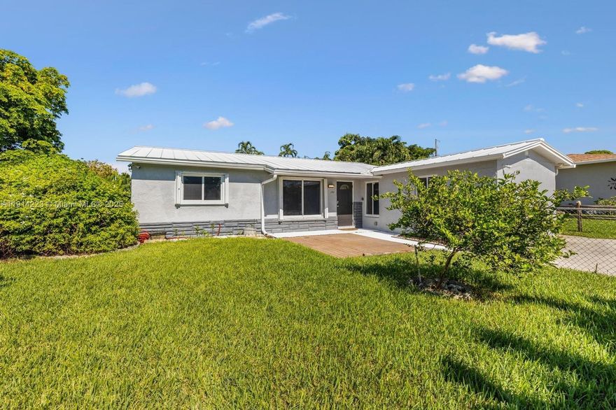 Discover this beautifully maintained 4-bedroom, 3-bathroom single-family pool home on a fenced corner lot in Pompano Beach! This home boasts a metal roof (2019), updated electrical panel (2024), A/C (2019), and replaced ductwork (2021). Enjoy energy efficiency with a solar hot water heater and new heating element (2021). Remodeled kitchen with new porcelain floors. 2024 new plumbing. Security features include a monitored perimeter alarm system, six outdoor cameras, and a Honeywell Total Connect 2.0 controller for remote operation and viewing, complete with 5G LTE cellular communication. A must-see home offering modern upgrades, security, and peace of mind! Schedule your showing today!