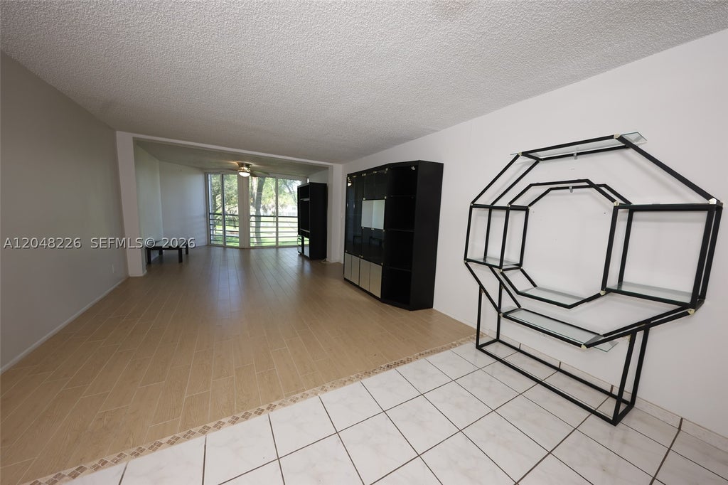 Photo of 1831 Sabal Palm Dr #208, Davie, FL 33324 (MLS # A12048226)