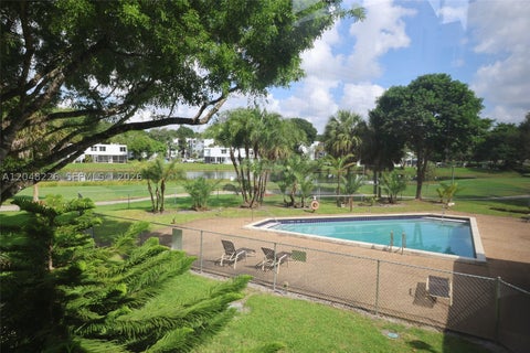 Photo of 1831 Sabal Palm Dr #208, Davie, FL 33324 (MLS # A12048226)