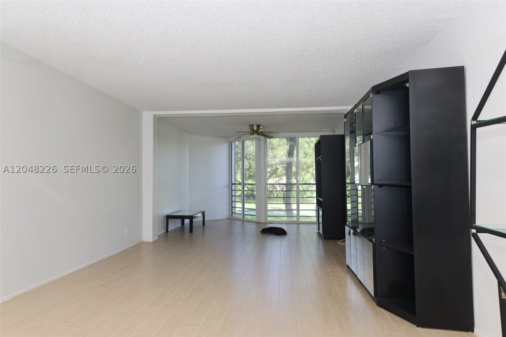 Photo of 1831 Sabal Palm Dr #208, Davie, FL 33324 (MLS # A12048226)