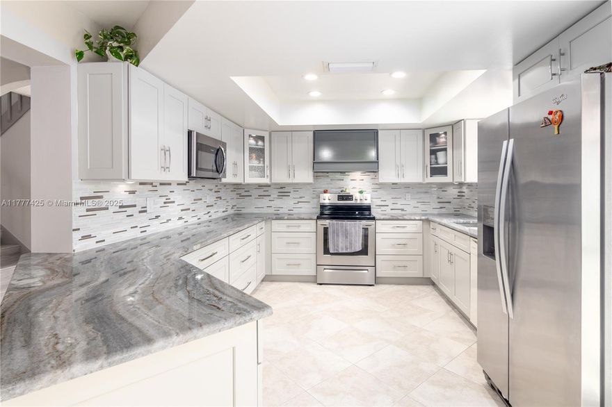 Wow, Look at this beautiful, super clean, very well maintained, updated single family Pool home on a quiet side street. This 4 bed, 2.5 bath with Den and Loft space is packed full of upgrades. Master Suite on the first floor with beautiful master bath, New kitchen with gorgeous granite counter tops. Kitchen opens up into the Living room and Formal Dining room, perfect for entertaining.  Three beds, loft and full bath on second floor. New floors, Impact windows and doors except for two, have transferable lifetime warranty. New Roof in 2021, New pool surface, AC only 9 years old. Mango and avocado trees, in this impeccably maintained front and back yard. Two car garage. Cable and high speed Internet included in the low HOA fee. This non gated Community has Tennis, Basketball, BBQ and gym.