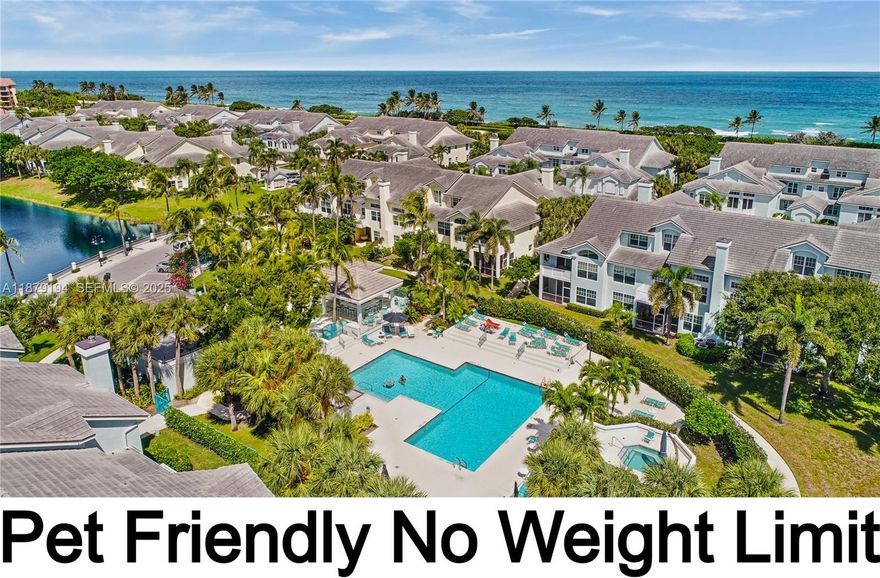 SIRS & MILESTONE ENGINEERING REPORTS COMPLETED!!  Pet friendly community with a path to the pet friendly beach.  FULLY RENOVATED townhouse with porcelain wood look floors, quartzite counters, PGT hurricane impact windows/doors, new ceiling fans, both baths remodeled, wood burning fireplace, 17 foot ceilings, +++. THE ONLY MODEL WITH 2 SETS OF EXTRA TALL SLIDING DOORS. Sunny south exposure with a private balcony & green space views (only 8 units in the community have a private balcony). 1 car garage & plenty parking spaces next to the unit. Living space starts on 2nd floor & there is a staircase. Beautiful new pool, a gym & outdoor social / party area.  24hr manned gate.  Roof was recently replaced.  2 pets are allowed with NO weight limit.