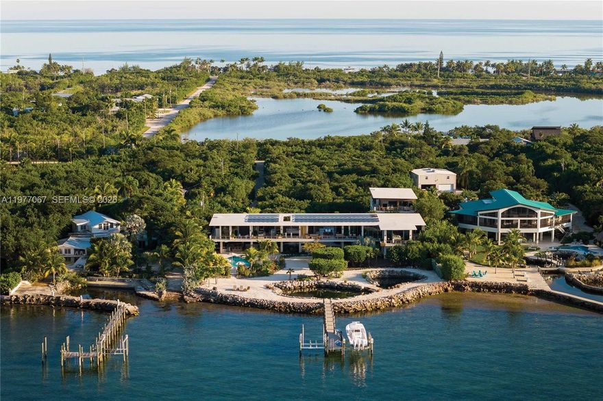 A Private Waterfront Estate at The Edge of the Gulf of America. Set on 3 secluded acres+/- along one of the most
protected stretches of the Gulf of America, 57783 Morton Street is a newly completed estate of rare scale, privacy,
and modern coastal design. Surrounded by water, sandscape, and tidal ponds alive with marine life, the property
offers more than 200’+/- of direct water frontage and uninterrupted views across the open Gulf. Completed in
2025 by builder and developer Alderuccio Corporation, this resilient, elevated retreat is constructed entirely of
concrete and impact glass and is designed for effortless indoor–outdoor living. With three distinct finished living
spaces totaling approximately 10,000 SF+/-, the estate functions as a private resort offering privacy, recreation,
and exceptional access to the best of the Florida Keys.