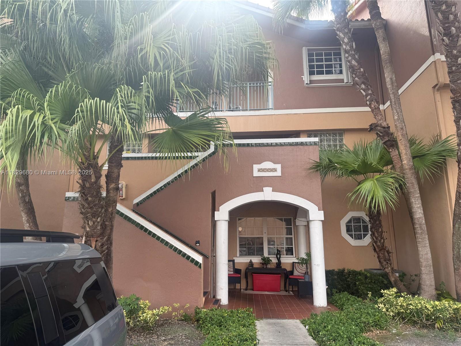 In the desirable Hammocks community! This home features two master suites, each with a walk-in closet, full bathroom, and private balcony. Fully tiled and move-in ready, it boasts a spacious eat-in kitchen with a breakfast bar and a convenient W/D closet. With ample storage space, a generous living area, and three balconies, this condo is a perfect place to call home.