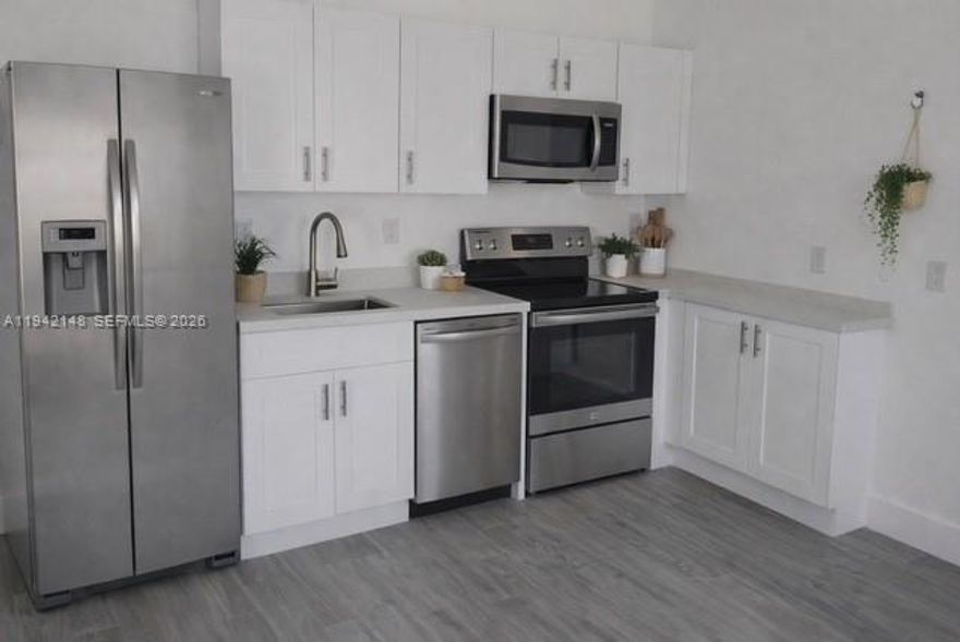 Consider it new!!!! Beautiful unit of this remodeled duplex in Little River / Little Haiti. 3 bedroom, 2 bathrooms. Stainless steel appliances. Wood floors. Blocks away from great developments. Restaurants, Coffee shops. Must see. Section 8 welcome.