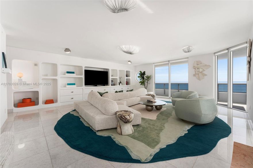This exquisite 4,599 SF unit at Villa Di Mare, an exclusive oceanfront boutique building with only 12 private units, offers 5BR/6.5BA, marble floors, & a wraparound terrace w/stunning ocean, bay, & city views. Unit includes a large cabana w/full bath. Open-concept living & dining area is designed for luxurious oceanside living. Sleek Boffi kitchen boasts a stainless-steel center island, custom cabinetry, top-tier appliances, plus adjacent breakfast area & family room. Expansive oceanfront principal suite has direct terrace access, sunrise views, his/her walk-in closets - his/her ensuite baths. 4 additional bedrooms include ensuite baths - staff quarters, guest room & 2 large east-facing rooms offer bay/city views. Private beach access & prime location next to Bath Club, fine dining, shops.