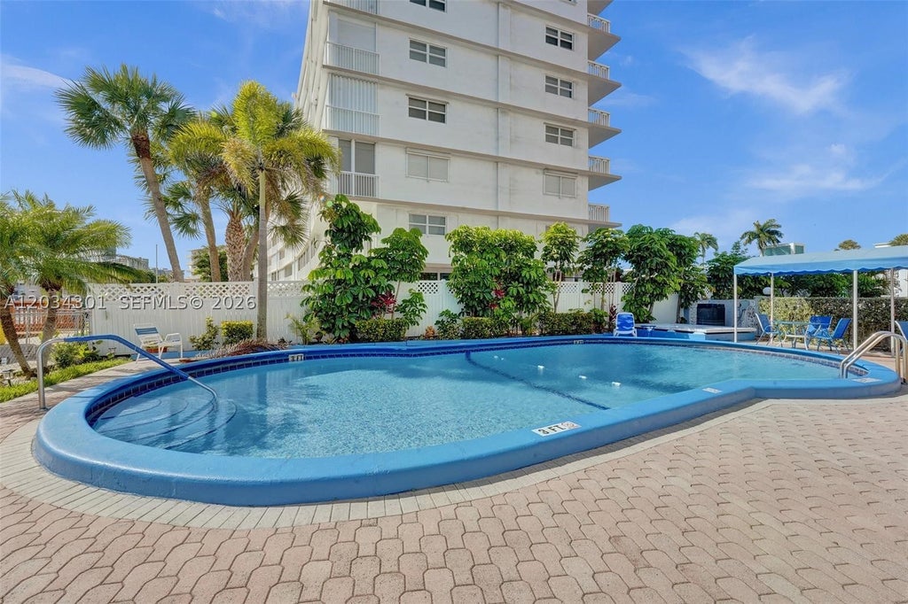 Photo of 430 Golden Isles Dr #705, Hallandale Beach, FL 33009 (MLS # A12034301)