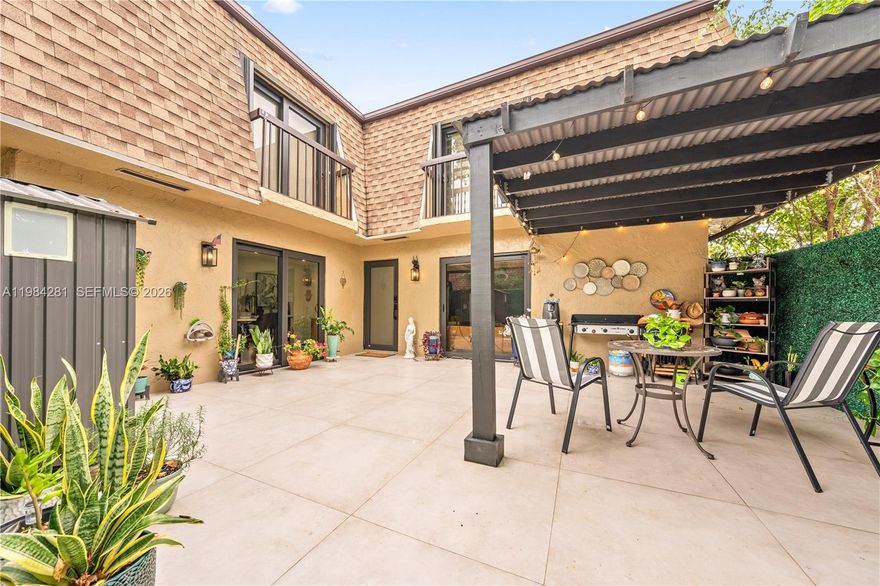 Welcome to next-level living in the gated enclave of Lago Grande. This Smart Home has been flawlessly reimagined with no expense spared. The 1,462 SF open-concept floor plan shines with polished large-format ceramic tile and a chef’s kitchen featuring imported cabinetry, quartz countertops, and smart energy-efficient appliances. The primary full bathroom offers a spa-inspired escape with a floating vanity and frameless rain shower, complemented by a designer half-bath for guests. The primary suite serves as a true sanctuary, complete with a built-in closet and impact sliders leading to a private balcony. Entertain in style on your expansive patio under a custom pergola and string lighting. Peace of mind is paramount with full impact windows/doors PLUS hurricane shutters plus Smart Home automation giving you control from anywhere. Community amenities: pool, basketball, and 24/7 guard gate. No Rental Restrictions - lease right away. All assessments PAID. This turnkey gem is move-in ready!