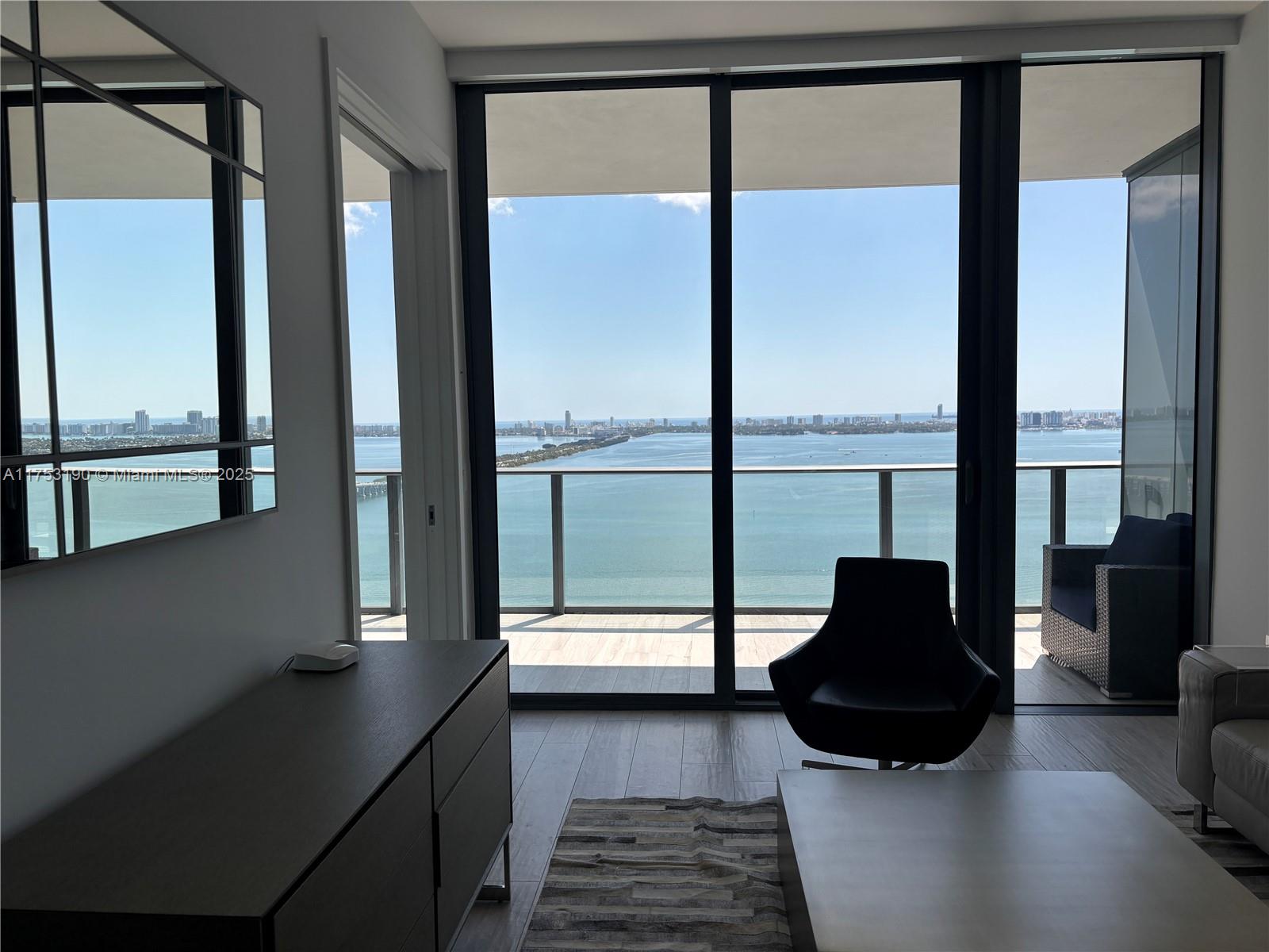 Experience luxury living in this stunning furnished unit at Gran Paraiso, featuring a spacious terrace with breathtaking bay & ocean views, two beds, three full baths, and a PRIVATE elevator. Designed by renowned Piero Lissoni, this residence boasts top-of-the-line finishes, including high-end appliances, porcelain floors, and elegant granite countertops. Enjoy world-class amenities: a two-acre pool deck, BBQ area, tennis courts, gym, spa, sauna, business center, theater, cigar lounge, private wine cellars, club rooms, children's playroom, bowling, golf simulator, and billiards. Residents also have exclusive access to the acclaimed Amara at Paraiso restaurant.
Ideally located just minutes from Brickell, Midtown, Wynwood, and the Design District, and within 15 minutes of MIA. Easy to show!