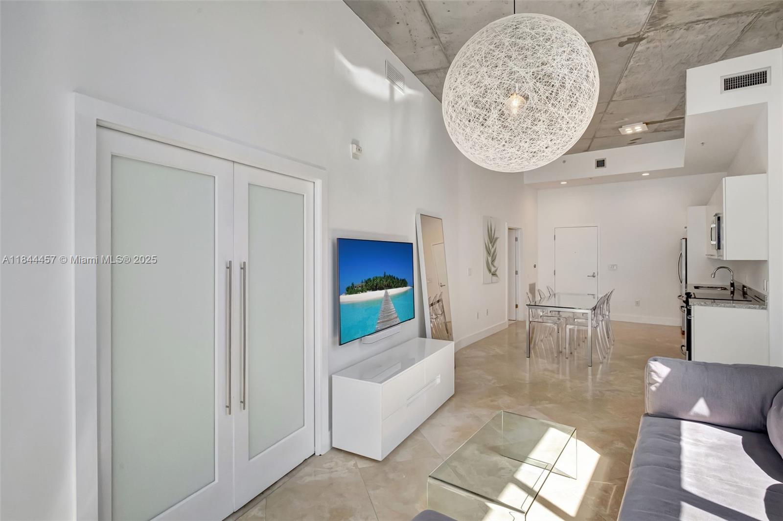 Loft-style penthouse one-bedroom with private balcony, soaring 13-foot ceilings, in-unit washer/dryer, custom closet, and assigned garage parking. Extra storage included. Offered unfurnished. Quiet boutique style building.
Amenities include a rooftop pool, jacuzzi, sun deck with panoramic views, gym, and 24-hour concierge/security. Prime location near Miami Beach Golf Course, Lincoln Road, Sunset Harbor, the beach, Convention Center, and Botanical Garden.