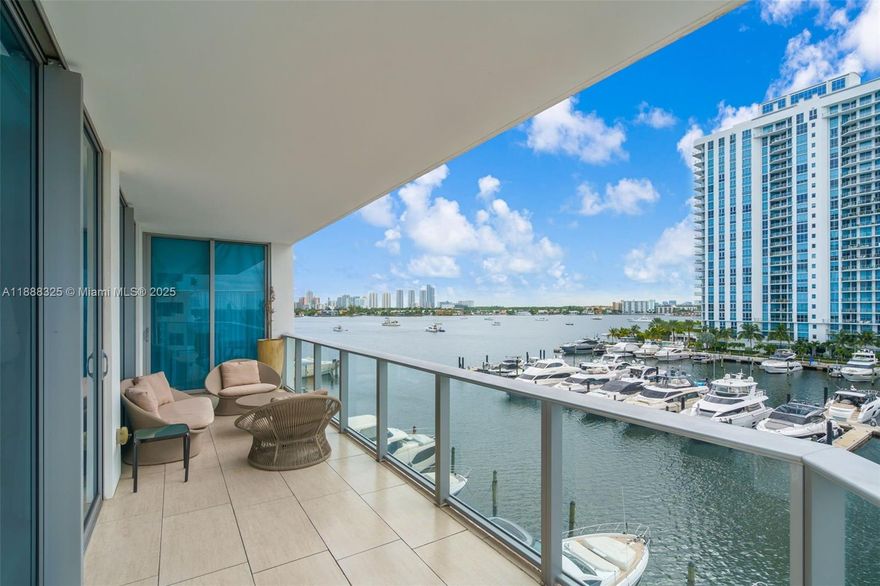 PRICED TO SELL! ENJOY 5-STAR WATERFRONT LIVING AT MARINA PALMS. STUNNING SE CORNER RESIDENCE WITH 2 BEDROOMS + DEN (ENCLOSED AS 3RD BEDROOM) AND 2.5 BATHS. PROFESSIONALLY DESIGNED BY ARTEFACTO WITH BEAUTIFUL UPGRADES. LOCATED ON THE 5TH FLOOR WITH BREATHTAKING UNOBSTRUCTED VIEWS OF THE MARINA AND BAY. FEATURES STONE FLOORS, SNAIDERO KITCHEN WITH WOLF, MIELE & SUB-ZERO APPLIANCES, AND ELEGANTLY FINISHED BATHROOMS. MASTER SUITE OPENS TO A LARGE BALCONY, PERFECT FOR ENTERTAINING. RESORT-STYLE AMENITIES INCLUDE FULL-SERVICE PRIVATE MARINA & YACHT CLUB, WATER SPORTS, FITNESS CENTER, SPA, CONCIERGE, BAYFRONT POOL, KIDS CLUB, AND MORE. MOVE-IN READY!