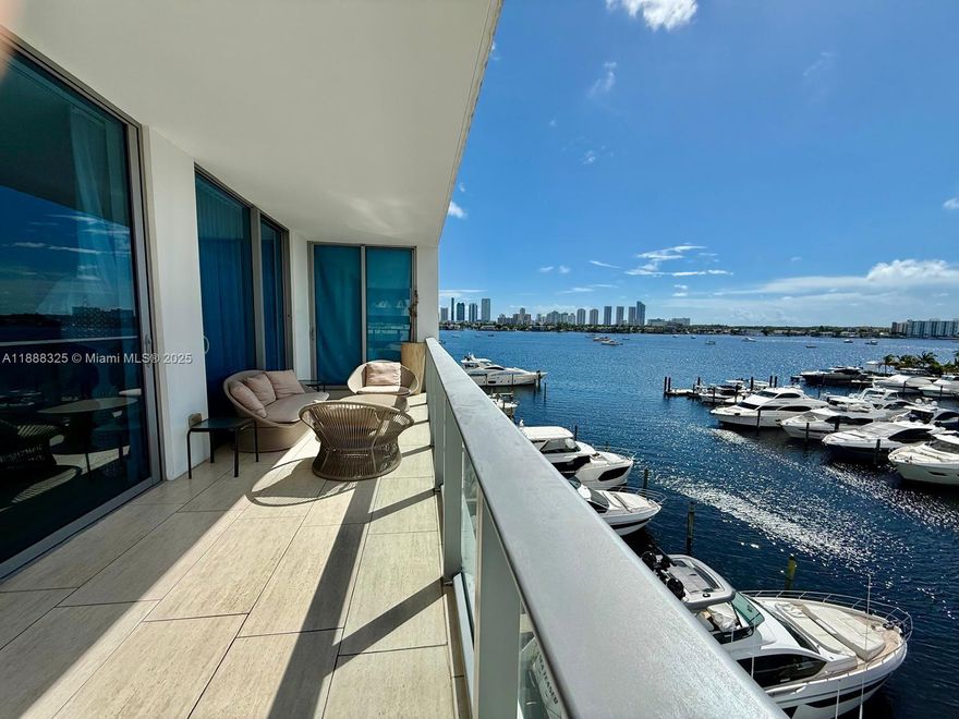 PRICED TO SELL! ENJOY 5-STAR WATERFRONT LIVING AT MARINA PALMS. STUNNING SE CORNER RESIDENCE WITH 2 BEDROOMS + DEN (ENCLOSED AS 3RD BEDROOM) AND 2.5 BATHS. PROFESSIONALLY DESIGNED BY ARTEFACTO WITH BEAUTIFUL UPGRADES. LOCATED ON THE 5TH FLOOR WITH BREATHTAKING UNOBSTRUCTED VIEWS OF THE MARINA AND BAY. FEATURES STONE FLOORS, SNAIDERO KITCHEN WITH WOLF, MIELE & SUB-ZERO APPLIANCES, AND ELEGANTLY FINISHED BATHROOMS. MASTER SUITE OPENS TO A LARGE BALCONY, PERFECT FOR ENTERTAINING. RESORT-STYLE AMENITIES INCLUDE FULL-SERVICE PRIVATE MARINA & YACHT CLUB, WATER SPORTS, FITNESS CENTER, SPA, CONCIERGE, BAYFRONT POOL, KIDS CLUB, AND MORE. MOVE-IN READY!