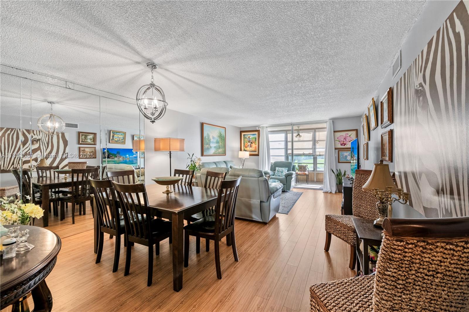 This beautifully renovated 2-bedroom, 2-bathroom condo in the highly sought-after 55+ community of Sunrise Lakes offers captivating lake and golf course views from a private screened balcony. Recent updates include a new A/C, hurricane-impact windows, wood flooring, upgraded baseboards, and elegantly remodeled bathrooms. Residents enjoy resort-style amenities including a complimentary 9-hole golf course, heated indoor and outdoor pools with Jacuzzi, fitness center, racquetball, pickleball, tennis courts, billiards, ping pong, shuffleboard, a main clubhouse with theater and ballroom, social clubs, BBQ areas, and a courtesy shuttle bus. With low turnover and high demand, this is a rare opportunity to own in one of Sunrise’s most desirable active adult communities.