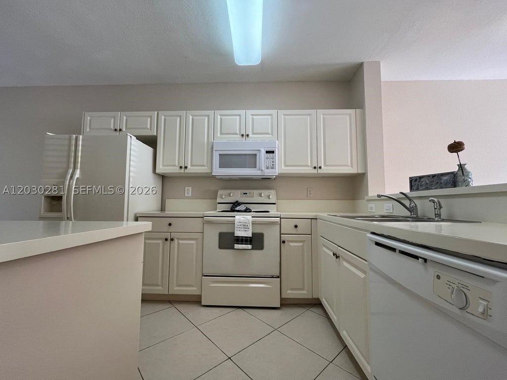 Photo of 1932 Alamanda Way #1932, Riviera Beach, FL 33404 (MLS # A12030281)