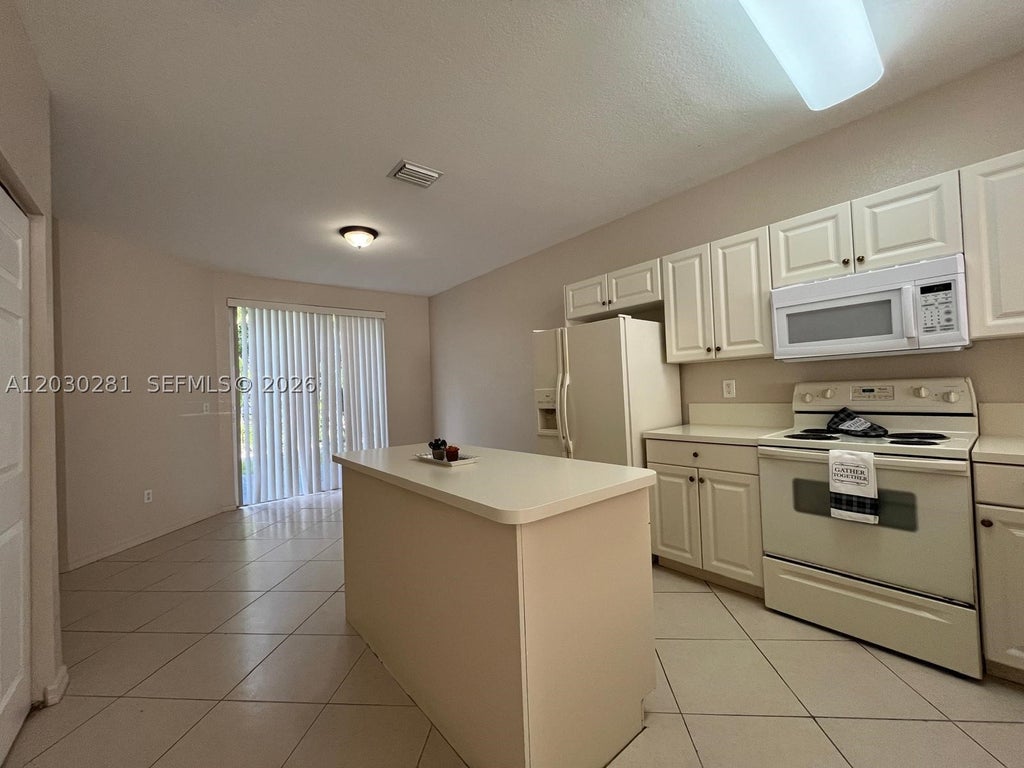 Photo of 1932 Alamanda Way #1932, Riviera Beach, FL 33404 (MLS # A12030281)