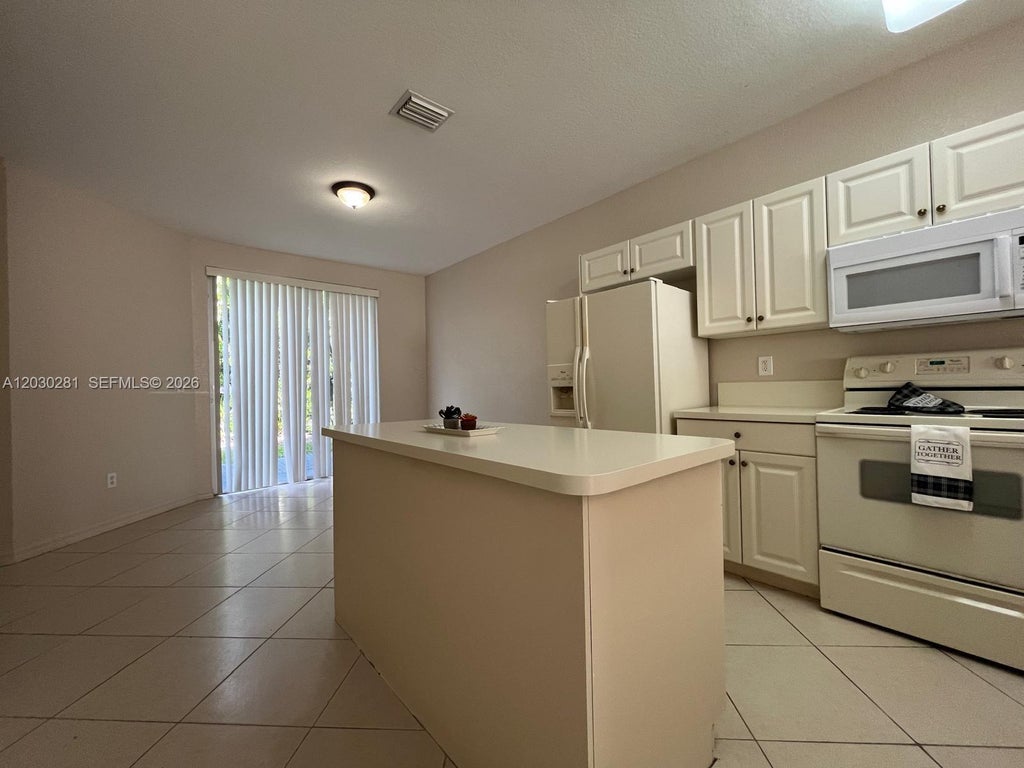 Photo of 1932 Alamanda Way #1932, Riviera Beach, FL 33404 (MLS # A12030281)