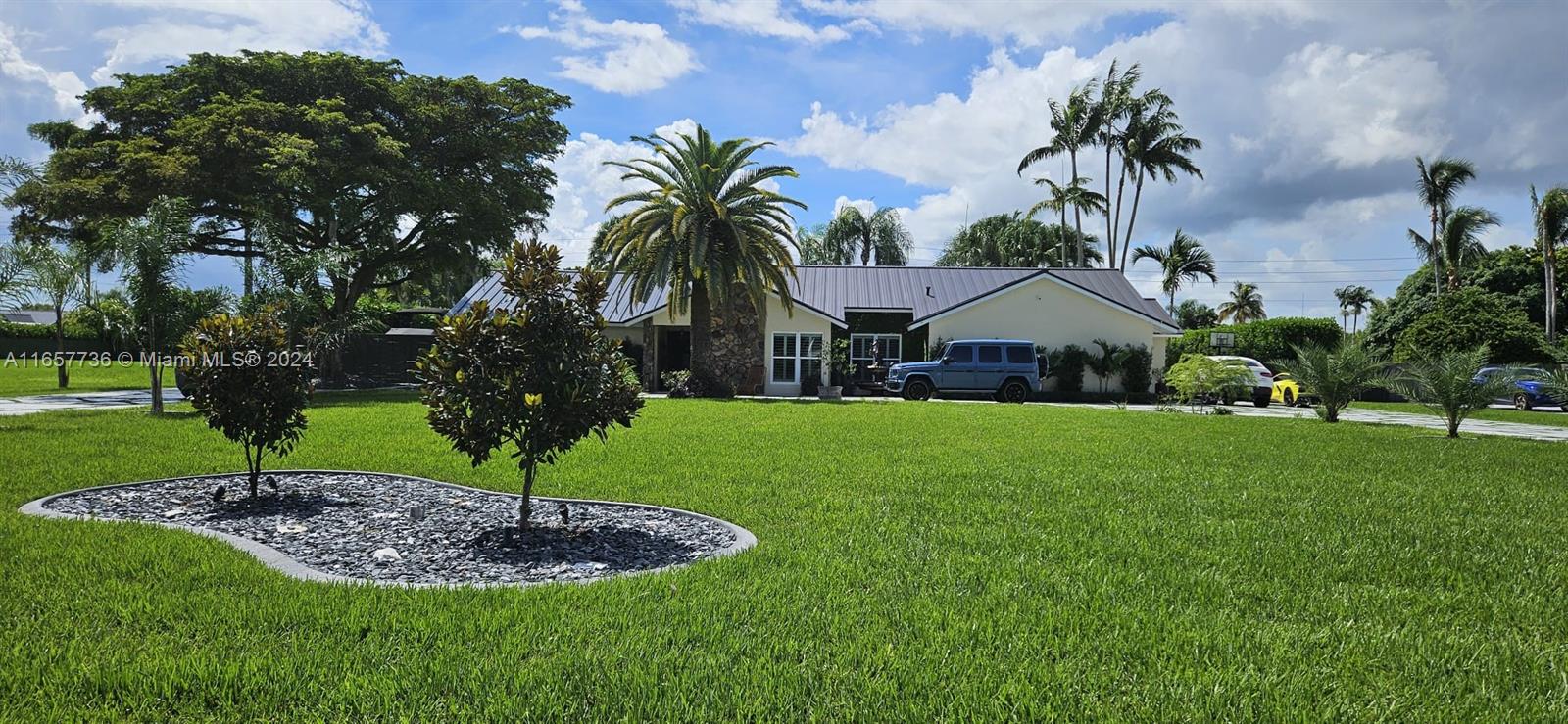 A Miami dream home in exclusive Stone Wood Estates. New lighting throughout home. Two fully remodeled bathrooms. A fully remodeled kitchen. New metal roof. Hurricane impact windows and doors. New garage doors. Wood fireplace. Expansive one acre lot with new modern driveway. Fully remodeled landscaping.