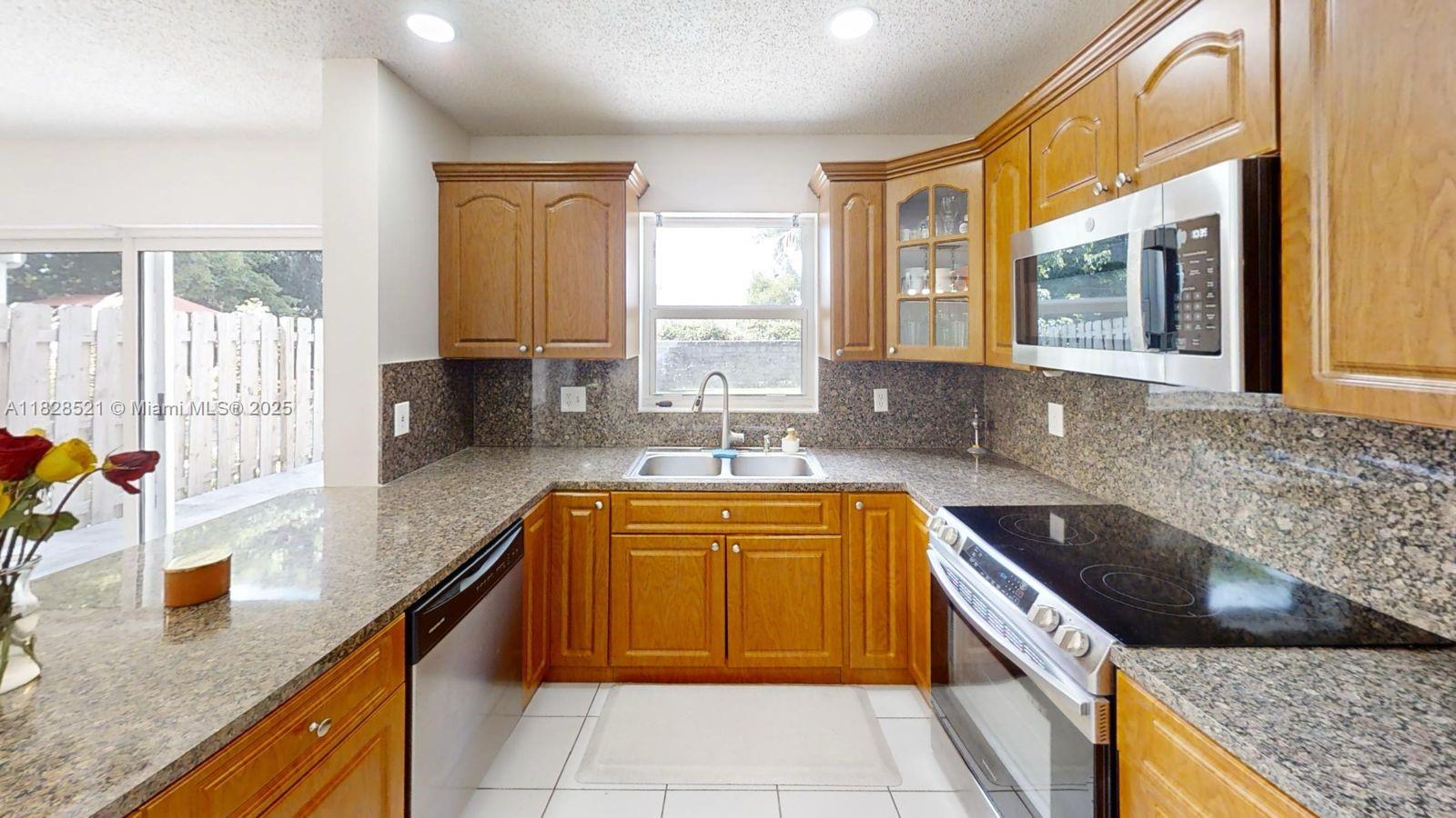 Move-in ready single home in Pine Island Bay, 3 bedrooms and 2.5 bath, with all bedrooms located upstairs for added privacy. The spacious primary suite includes a private en-suite bath, while the two secondary bedrooms share a large Jack and Jill bathroom with dual sinks- ideal for family living. The first floor boasts ceramic tile, while the second floor features elegant laminated flooring throughout. A beautifully updated half bath/powder room is located downstairs for guests. Enjoy a large upgraded fenced back patio, perfect for outdoor entertaining or relaxation. Conveniently located near shopping centers, Nova-Southeastern University, Fort Lauderdale international Airport. A must see home in one of Davie's most desirable communities!!