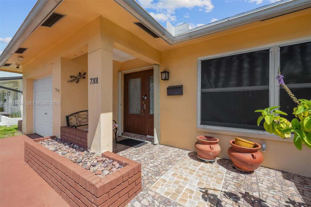Photo of 7301 NW 57th Pl, Tamarac, FL 33321 (MLS # A12001052)