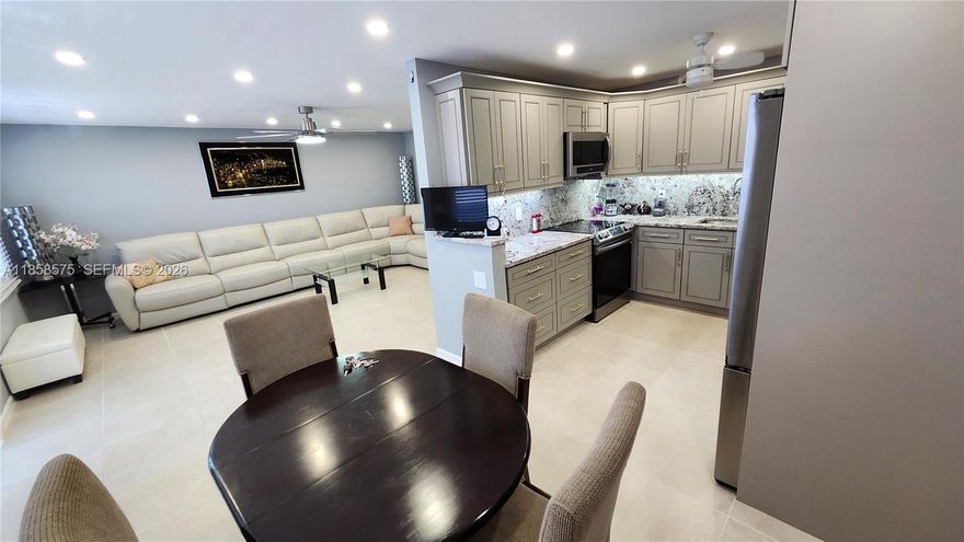 55+PRICE IMPROVEMENT for a Remodeled turnkey 2-bedroom 2 full bathrooms unit in a resort style community! Large, enclosed balcony overlooking a plush garden.  Recent updates include high-end real wood kitchen cabinets, granite countertops and Samsung appliances.  Hurricane impact windows and front door, smooth ceiling with spotlights, tile/laminate floors. new bathroom vanities, electric panel and much more! Fully furnished. Well maintained luxury building located steps away from the state-of-the-art clubhouse and a pool.  Low maintenance fee of $663/mo includes water, cable and all the amazing amenities! Century Village is an active community with 13 pools, tennis courts, biking/jogging pass, gym, theater, community shuttles, and so much more. 15 min to the beach.