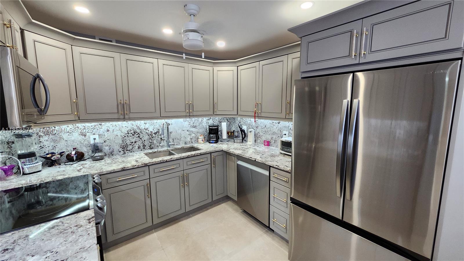 55+ Remodeled turn key 2-bedroom 2 full bathrooms unit in a resort style community! Large enclosed balcony overlooking a plush garden. Recent updates include high-end real wood kitchen cabinets, granite countertops and Samsung appliances. Hurricane impact windows and front door, smooth ceiling with spotlights, tile/laminate floors. new bathroom vanities, electric panel and much more! Fully furnished. Well maintained luxury building located steps away from the state-of-the-art clubhouse and a pool. Low maintenance fee of $663/mo includes water, cable and all the amazing amenities! Century Village is an active community with 13 pools, tennis courts, biking/jogging pass, gym, theater, community shuttles, and so much more. 15 min to the beach.
