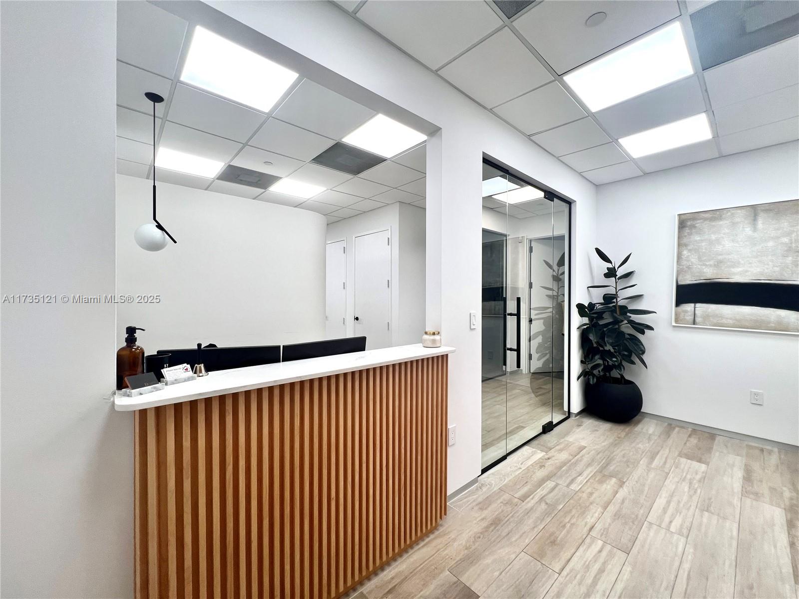 Entry/reception with privacy window. Large open area for work stations. Conference room. Four private offices. Full kitchen. Separate file room Hardwood laminate floors throughout.