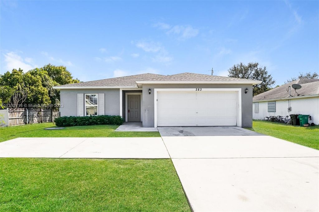 Photo of 283 SW Tulip Blvd, Port Saint Lucie, FL 34953 (MLS # A11352718)