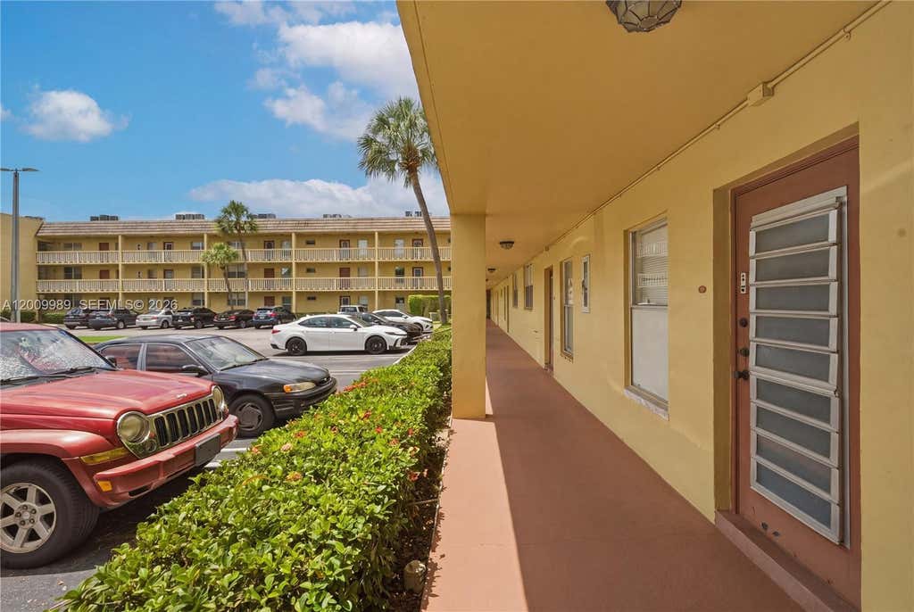 Photo of 5961 NW 61st Ave #111, Tamarac, FL 33319 (MLS # A12009989)