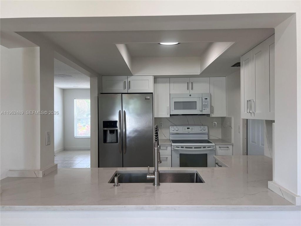 Photo of 7313 NW 57th Ct, Tamarac, FL 33321 (MLS # A11962489)