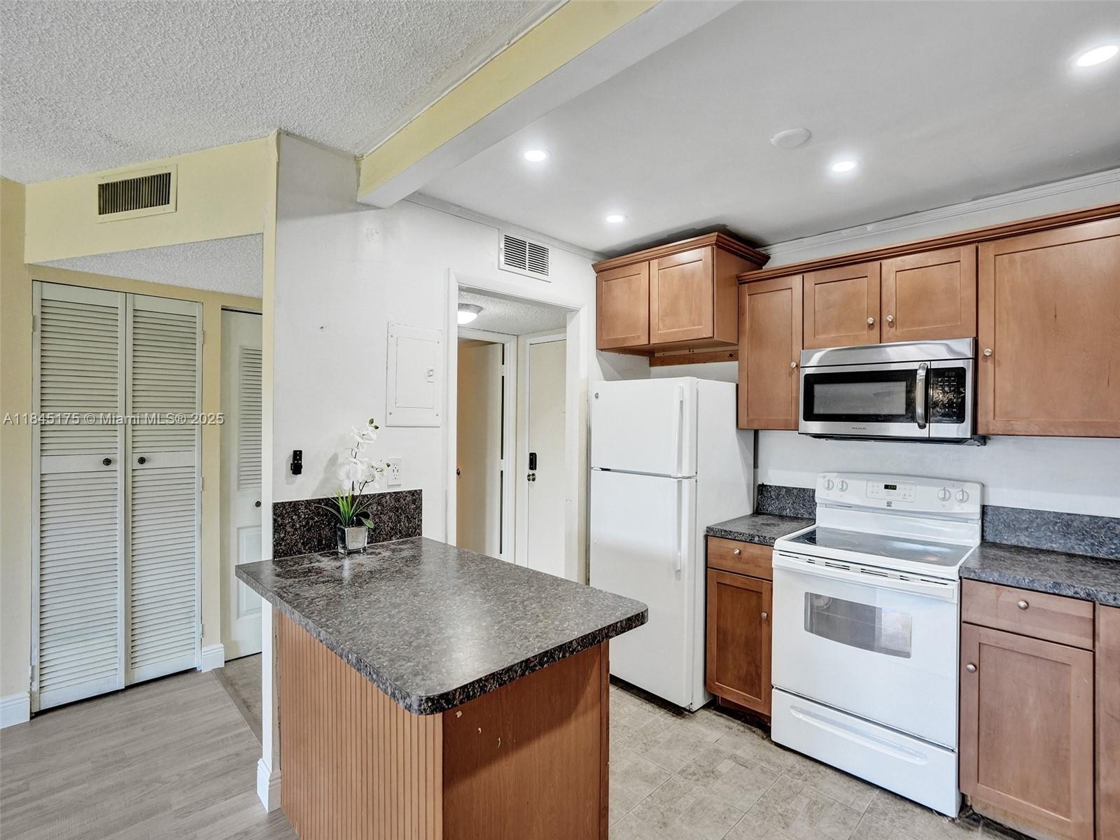 NEWLY RENOVATED & TASTEFULLY DECORATED CONDO WITH AN OPEN CONCEPT NEW KITCHEN, A 1/2 BATH, AND LARGE MASTER BATHROOM. KITCHEN W/ GOREGEOUS WOOD CABINETS & GRANITE COUNTERS, NEWER STAINLESS STEEL APPLIANCES AND LOTS OF NATURAL LIGHTING. LIVING ROOM AND BEDROOM W/NEW LAMINATE FLOORING. WASHER/DRYER IN THE UNIT. THIS IS A SECURED LOBBY BUILDING. THE COMMUNITY HAS A SWIMMING POOL AND BASKETBALL COURT. EASY COMMUTE THROUGH NEARBY OAKLAND PARK BLVD AND UNIVERSITY DRIVE. THE TURNPIKE AND I-95 ARE JUST A FEW MINUTES AWAY. MIN. INCOME OF AT LEAST $4500 A MONTH. ONLY FIRST AND REFUNDABLE SECURITY DEPOSIT TO MOVE IN + $500 REFUNDABLE ASSOCIATION SECURITY DEPOSIT.