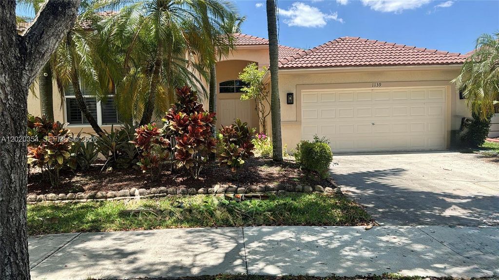 Photo of 1139 Chenille Cir, Weston, FL 33327 (MLS # A12020354)