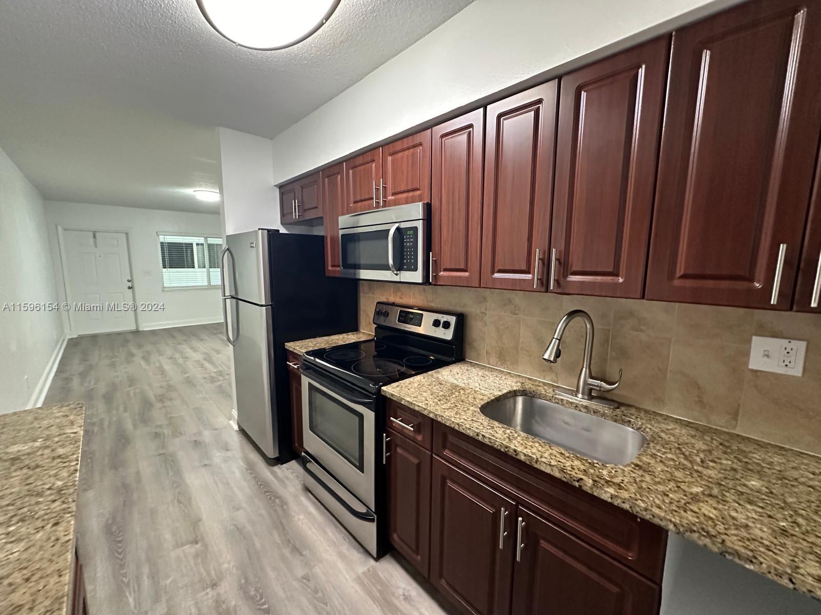 LOCATION!!! Coastal living at its finest! Live 2 blocks away from the ocean in this quiet, charming Deerfield community. Beautiful & spacious 1st floor corner unit. 2 bedroom 1 bath apartment w/ top-tier upgrades & a large private screened-in balcony/porch! Comes with 2 assigned parking spaces right in front of property. Unit is upgraded w/ new flooring & lighting. Features granite countertops, wooden cabinets, dishwasher, central AC & multiple closets for ample storage. Community is located right on the inter-coastal w/ a picnic area for residents. Walking distance to beach, the Cove Shopping center, amazing restaurants & bars, shops, parks & more. Laundry in building & on each floor. Water, waste, sewer included in rent. Pets welcome w/ small non-refundable pet fee. Handicap accessible.