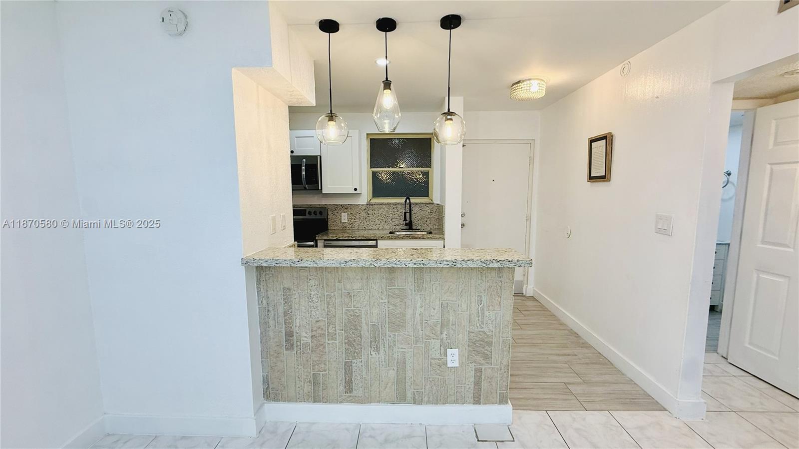 Beautiful ground-floor condo of 615 sq ft, fully remodeled and move-in ready. Located in a secured gated community with private parking and a sparkling community pool. This bright 1-bedroom, 1-bathroom unit features new flooring, new laundry in site and elegant ceiling lamps. The spacious living area opens to a screened balcony, perfect for relaxing. No pets and no leasing allowed, ensuring a quiet and stable environment. With its stylish upgrades and excellent location, this condo is a perfect investment for a first home.