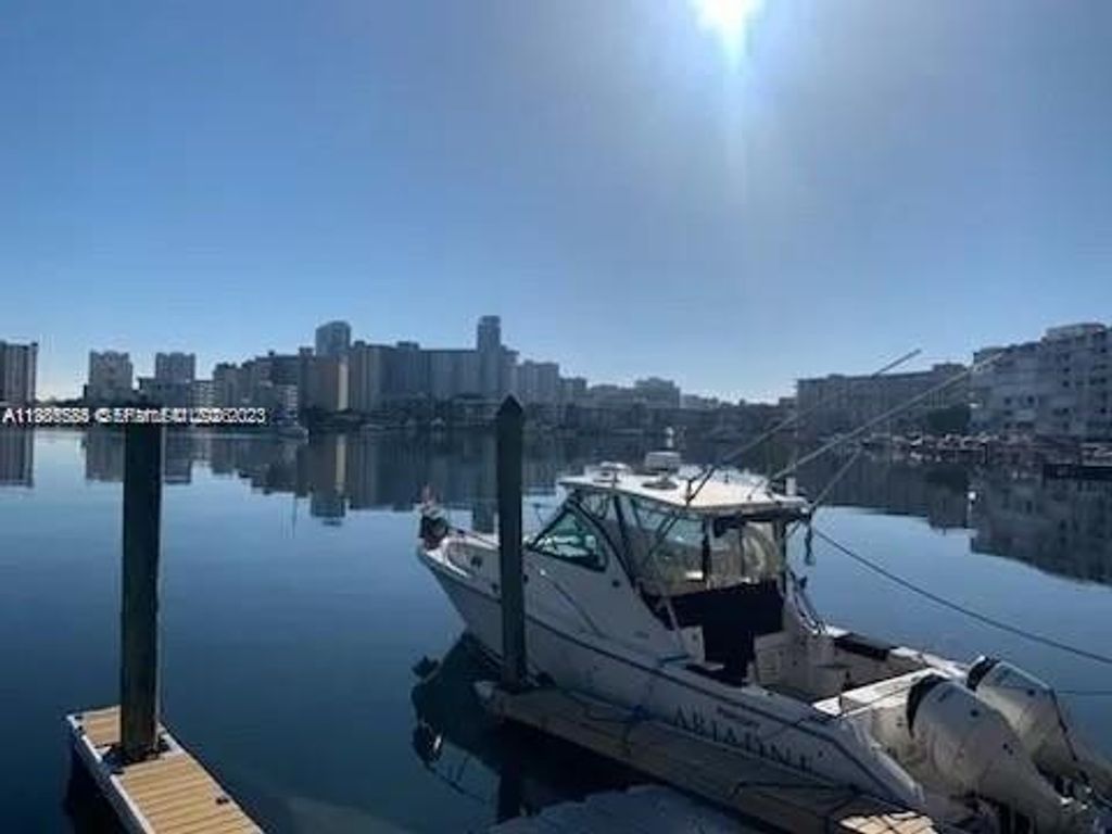 Photo of 462 Golden Isles Dr #202, Hallandale Beach, FL 33009 (MLS # A11986584)