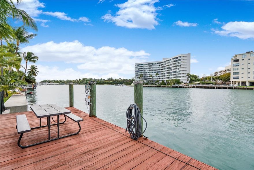 Live the ultimate waterfront lifestyle on coveted Bay Drive in Surfside, Florida! This completely updated contemporary home is built on a 10,450’ oversized corner lot with ocean access and no fixed bridges. A welcoming front porch leads to the main entrance, and gleaming porcelain tile floors weave a stunning coastal vibe throughout the home. The open floor plan boasts 3 bedrooms, 3.5 baths, and an additional room and half bath that can be used as a game room, office, or 4th bedroom.  There is a gourmet island kitchen, a walk-in pantry, and a Passover kitchen. The master bedroom opens to the backyard, pool and dock, with beautiful sunset views of Biscayne Bay, with only a short walk to the beach, houses of worship, and the famous Bal Harbour Shops.