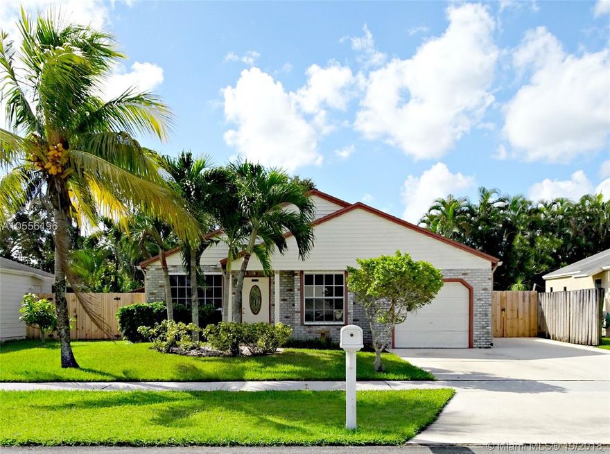 Wait till you see this fabulous single family home in one of the best school districts in Davie! Roomy 3 bedroom 2 bath with one car garage home in super friendly sidewalk lined Honey Lake.This home is MOVE IN READY! Nothing to be done. The eat in kitchen is GORGEOUS with granite, SS appliances, glass cabinets,built in china closet & a snack bar. Large living room with vaulted ceilings open to the kitchen add to the spacious feel of the house. 2 nice sized guest rooms & a large master en suite.Outside..wow! Your tropical oasis awaits with a patio under a sun setter awning complete with hot tub.Large fenced yard has an air conditioned shed. Hurricane shutters,generator panel hookup,110 outlet for RV & an extra wide driveway are other features in this great home.Don't delay, this won't last!