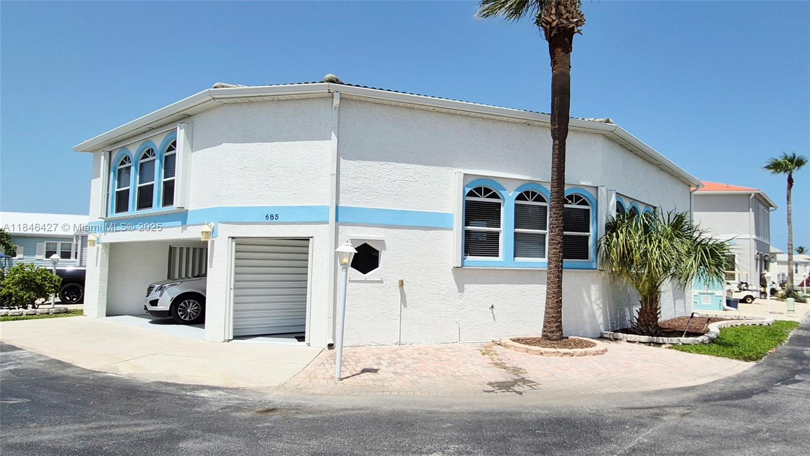 Life is better on an island! Charming 2-Story Coastal Home in Amenity-Rich Community is nestled between the Atlantic Ocean and the Intracoastal Waterway, this 2-bedroom, 2-bathroom block built home sits on a corner lot and offers a perfect blend of comfort and convenience. Enjoy easy access to the oceanfront via tunnel under A1A. The main floor features an open living space, while the master suite is located on the upper level, providing privacy and comfort. With a low monthly fee, you'll have access to a wealth of community amenities: a marina, boat and RV storage, tennis, bocce ball, volleyball, pickleball, basketball, shuffleboard, a community pool, and even a workshop!
Don’t miss this opportunity to live in a vibrant, coastal community with everything you need right at your doorstep!