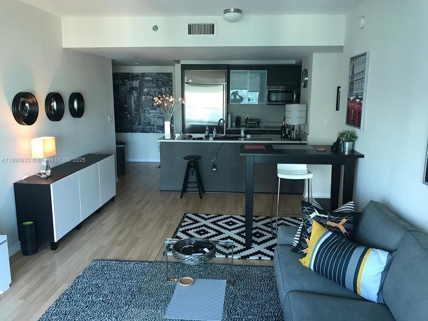 Immerse yourself in the luxury lifestyle of 500 Brickell East, where design and sophistication meet. This stunning 1BD/1BA residence boasts mesmerizing Bay and Downtown skyline views, sleek Italian cabinetry, quartz countertops, stainless steel appliances, and a smart home touchpad system. Indulge in five-star amenities including a rooftop infinity-edge pool, spa and sauna, private theater, yoga studio, and modern fitness center. Available October 25, 2025 — live the essence of Brickell luxury.