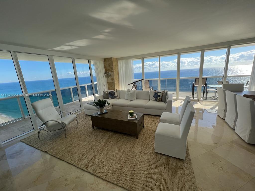 Breathtaking direct ocean and skyline views from every room or from your 586 Sq. Ft. wraparound balcony. This
stunning oceanfront 2 bedroom plus den and 3 full bathrooms corner unit with North East exposure has everything
you need. Features luxury finishes such as European kitchen, granite countertops, state of the art appliances, built-
in closets and marble floors throughout. Enjoy the views from floor to ceiling high impact windows with sliding
glass doors. Fully Furnished. The Beach Club offers concierge service, valet parking, beach service, 6 pools, bar
and restaurant service, and ultra-luxury 50,000 sq. ft. spa and ocean front fitness center. Perfectly located near
Gulfstream Park and the Hollywood boardwalk, Bal Harbour, South Beach